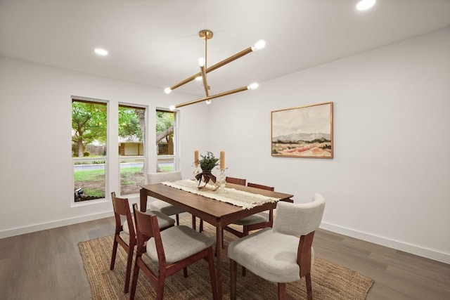 dining area with recessed lighting, baseboards, a chandelier, and wood finished floors