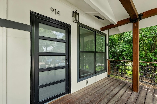 wooden deck with visible vents