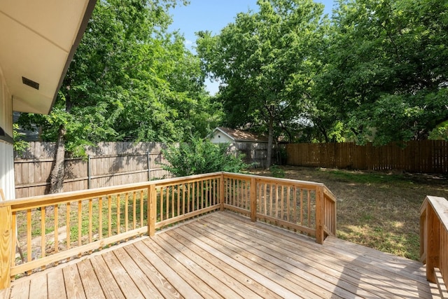 deck featuring a fenced backyard and visible vents