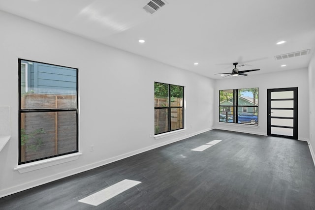 unfurnished room featuring recessed lighting, visible vents, and dark wood finished floors