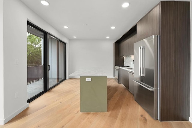 2209 S 1st St Unit 206, Austin, TX 78704 - kitchen with stainless steel appliances, modern cabinets, light countertops, a kitchen island, and recessed lighting