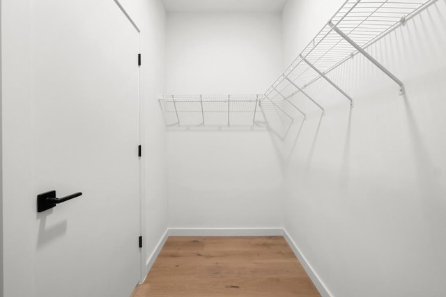 2209 S 1st St Unit 206, Austin, TX 78704 - walk in closet featuring light wood-style floors
