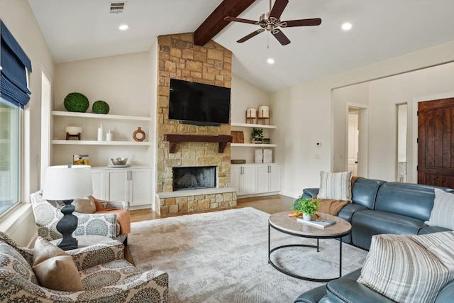 100 Red Barn Rd, Kingsland, TX 78639 - living area featuring a ceiling fan, a stone fireplace, wood finished floors, built in features, and recessed lighting