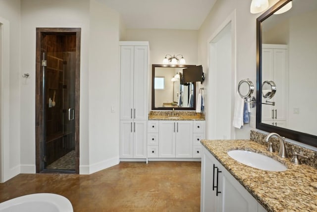 100 Red Barn Rd, Kingsland, TX 78639 - full bathroom featuring a shower stall, concrete floors, baseboards, two vanities, and a freestanding tub