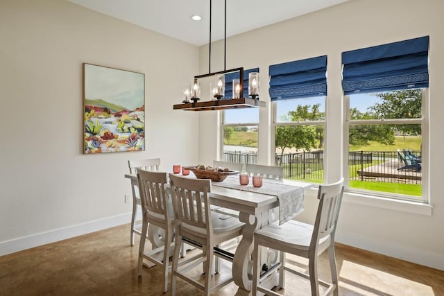 100 Red Barn Rd, Kingsland, TX 78639 - dining area featuring baseboards, healthy amount of natural light, finished concrete flooring, and recessed lighting