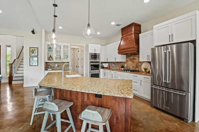 100 Red Barn Rd, Kingsland, TX 78639 - kitchen featuring appliances with stainless steel finishes, finished concrete floors, a sink, decorative backsplash, and recessed lighting