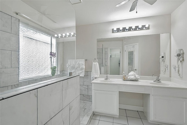 607 Columbine Ave, Cedar Park, TX 78613 - bathroom with a ceiling fan, double vanity, a shower, and tile patterned floors