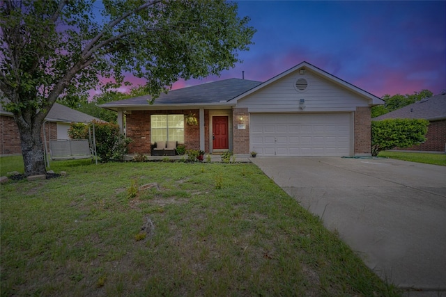607 Columbine Ave, Cedar Park, TX 78613 - ranch-style house with a garage, driveway, brick siding, and a yard