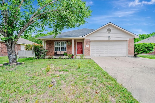 ranch-style home with concrete driveway, brick siding, a front yard, and a garage