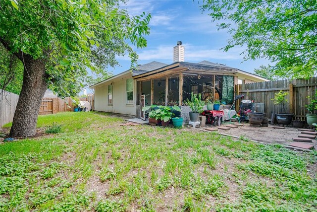 607 Columbine Ave, Cedar Park, TX 78613 - rear view of house with a chimney, a fenced backyard, and a patio