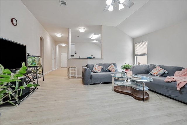 607 Columbine Ave, Cedar Park, TX 78613 - living area with arched walkways, light wood-style floors, ceiling fan, lofted ceiling, and baseboards