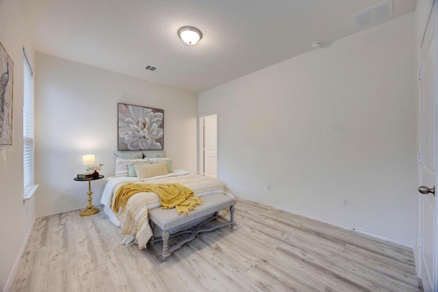 2950 E Old Settlers Blvd Unit 51, Round Rock, TX 78665 - bedroom featuring light wood-style flooring and baseboards