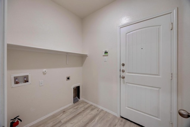 laundry area with laundry area, light wood-type flooring, gas dryer hookup, electric dryer hookup, and washer hookup