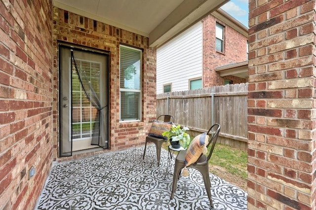view of patio / terrace featuring fence