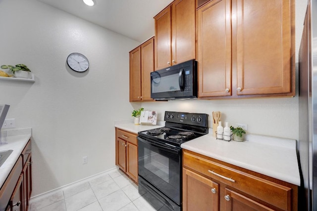 2950 E Old Settlers Blvd Unit 51, Round Rock, TX 78665 - kitchen featuring black appliances, light countertops, light tile patterned flooring, and brown cabinetry
