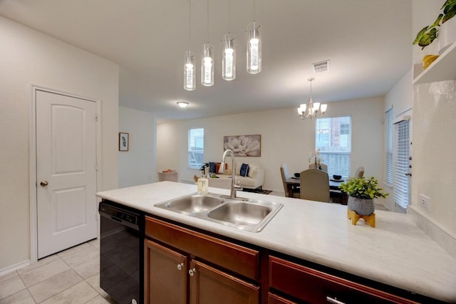kitchen with light tile patterned flooring, a sink, dishwasher, visible vents, and pendant lighting