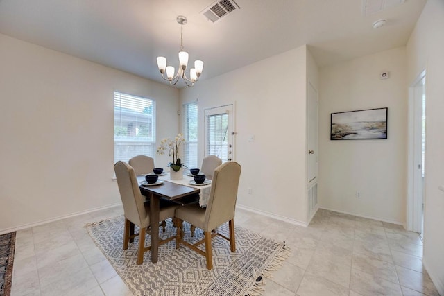 dining space featuring an inviting chandelier, baseboards, light tile patterned flooring, and visible vents