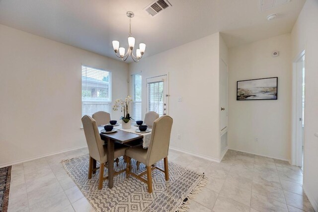 2950 E Old Settlers Blvd Unit 51, Round Rock, TX 78665 - dining area featuring a chandelier and light tile patterned flooring