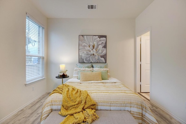2950 E Old Settlers Blvd Unit 51, Round Rock, TX 78665 - bedroom featuring wood finished floors and baseboards