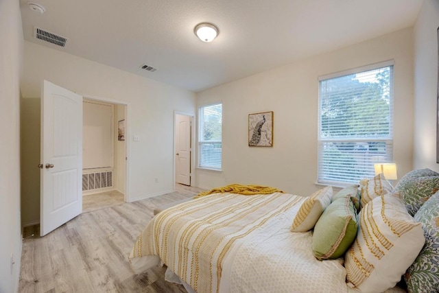 2950 E Old Settlers Blvd Unit 51, Round Rock, TX 78665 - bedroom featuring light wood-style floors and baseboards