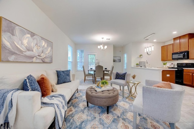 living room with recessed lighting, a notable chandelier, and light tile patterned floors
