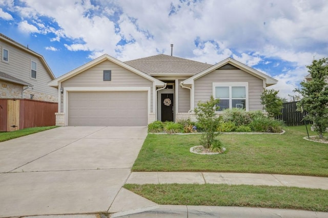 114 Lemuel Crawford Trl, Bastrop, TX 78602 - ranch-style house with concrete driveway, an attached garage, fence, and a front yard