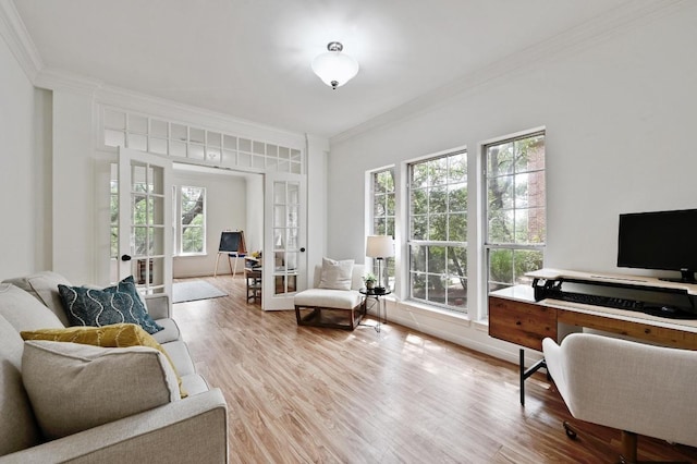 interior space with ornamental molding, french doors, and wood finished floors