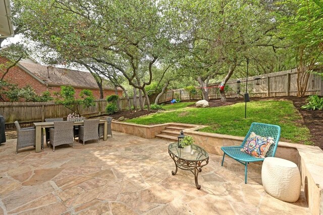5908 Front Royal Dr, Austin, TX 78746 - fenced backyard featuring outdoor dining space and a patio