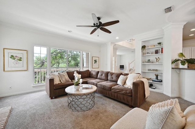 living room featuring carpet floors, crown molding, and visible vents