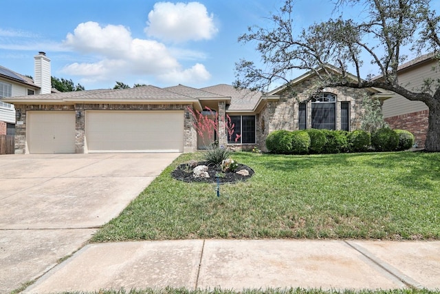 ranch-style house featuring an attached garage, a front lawn, brick siding, and concrete driveway