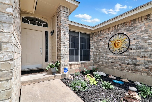 entrance to property with brick siding