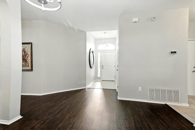 10733 Quarry Oaks Trl, Austin, TX 78717 - interior space featuring visible vents, wood finished floors, baseboards, and a notable chandelier