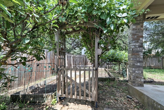 view of gate featuring fence