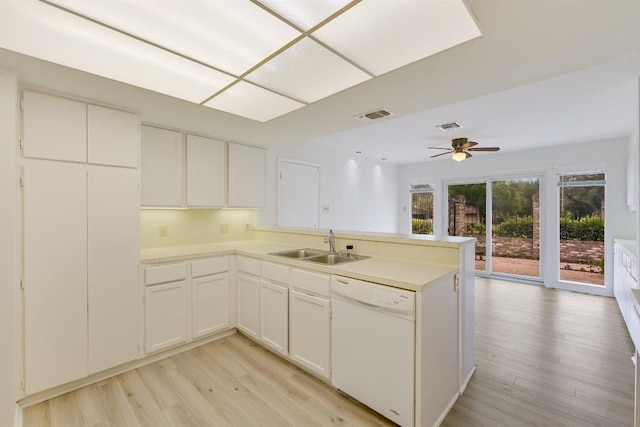 7916 Ridgeline N, Austin, TX 78731 - kitchen featuring dishwasher, light wood-style flooring, a sink, a peninsula, and ceiling fan