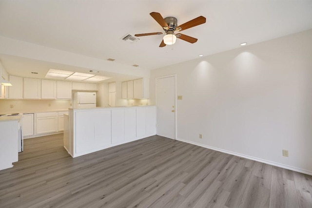 unfurnished living room with ceiling fan, light wood-style floors, recessed lighting, baseboards, and visible vents