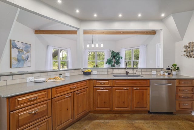 kitchen with a sink, dishwasher, a healthy amount of sunlight, and brown cabinets