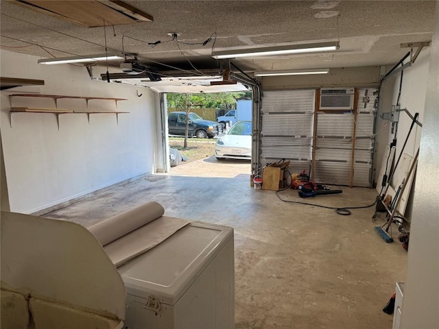 garage featuring a garage door opener and a wall mounted AC