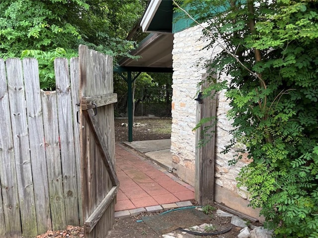 view of gate featuring fence