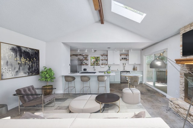 1715 Mearns Mdw, Austin, TX 78758 - kitchen with open shelves, stainless steel dishwasher, white cabinets, a skylight, and a peninsula