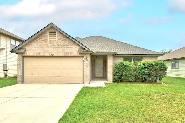 ranch-style home featuring brick siding, an attached garage, driveway, and a front yard