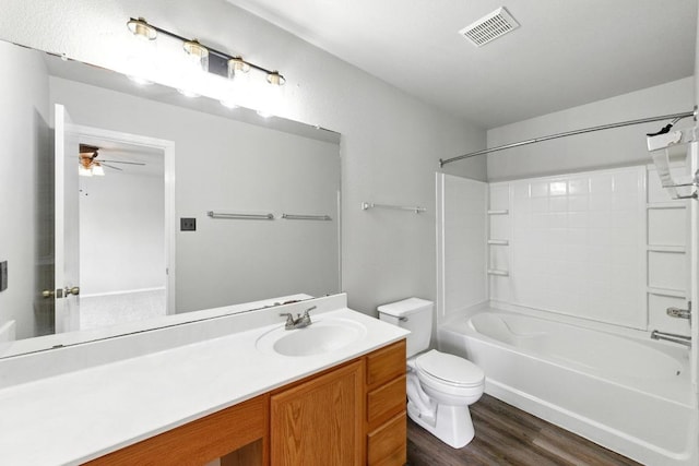full bath with a ceiling fan, visible vents, shower / tub combination, wood finished floors, and toilet