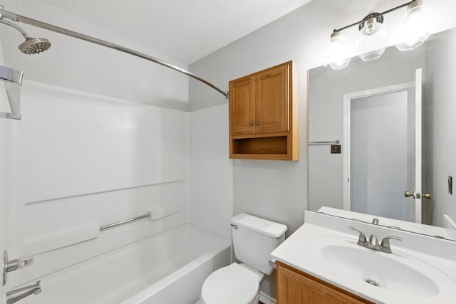 bathroom featuring toilet,  shower combination, and vanity