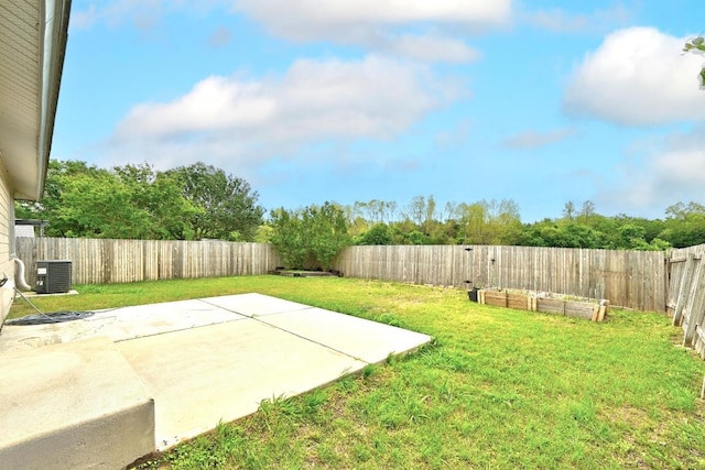view of yard featuring a patio, central AC unit, a garden, and a fenced backyard