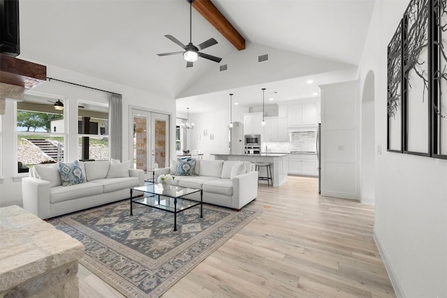 275 Axis Cir, Fredericksburg, TX 78624 - living room featuring a ceiling fan, beamed ceiling, light wood-style flooring, high vaulted ceiling, and recessed lighting