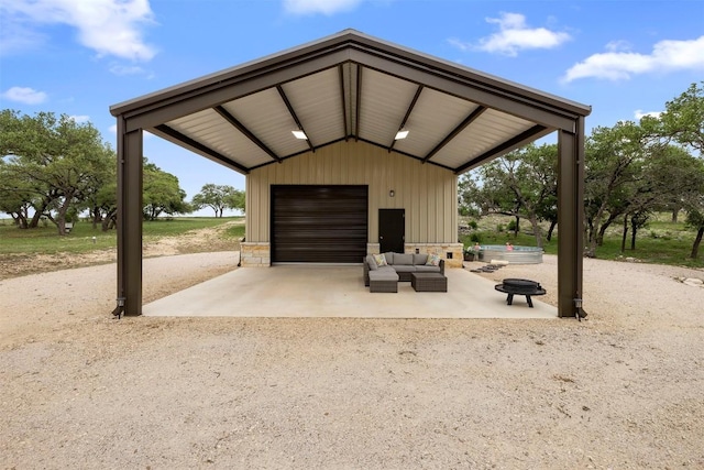 275 Axis Cir, Fredericksburg, TX 78624 - view of home's community with an outdoor structure, a garage, and an outdoor living space