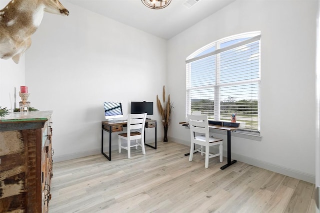 275 Axis Cir, Fredericksburg, TX 78624 - office with wood finished floors, plenty of natural light, a chandelier, and baseboards