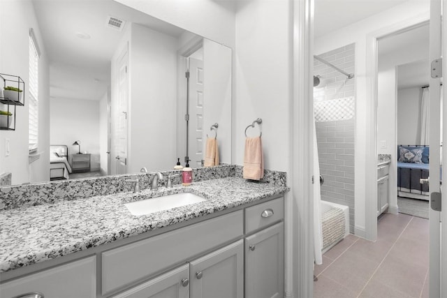 275 Axis Cir, Fredericksburg, TX 78624 - ensuite bathroom with vanity, shower / washtub combination, and tile patterned flooring