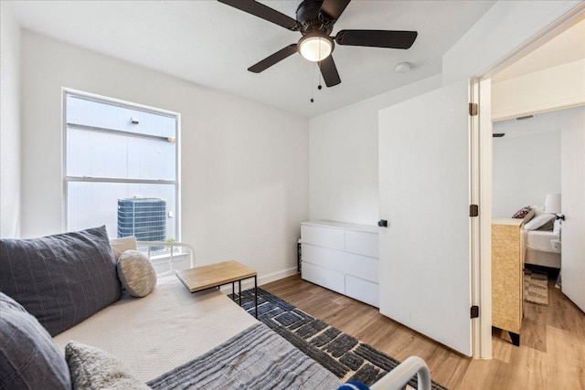 3405 Barksdale Dr, Austin, TX 78725 - bedroom with light wood-type flooring, multiple windows, and ceiling fan