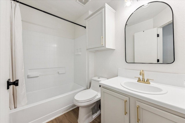 3405 Barksdale Dr, Austin, TX 78725 - bathroom with vanity, shower / bathtub combination with curtain, and wood finished floors