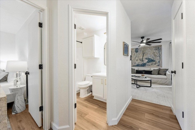 3405 Barksdale Dr, Austin, TX 78725 - hallway featuring light wood finished floors and baseboards